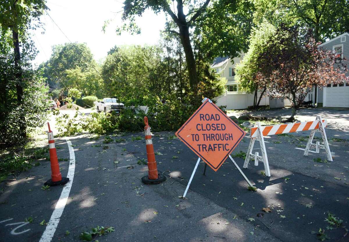 A tree is down on Oval Avenue in Riverside the day after the remnants of Hurricane Ida hit Greenwich, Conn. Thursday, Sept. 2, 2021. More than six inches of rain fell Wednesday into Thursday morning, causing severe flooding and power outages.