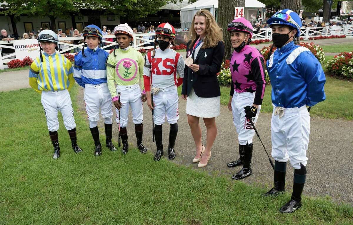 Olympic Bronze Medalist Emma White greats the jockeys for the 7th race on the card at the Saratoga Race Course Thursday Sep, 2 2021 in Saratoga Springs, N.Y. Special to the Times Union Photo by Skip Dickstein