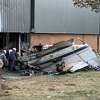 Investigators look through the wreckage of Thursday morning's plane crash at the Trumpf building in Farmington.