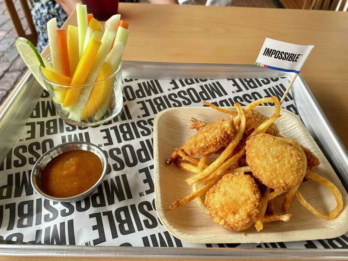 Impossible's nuggets are served with tomatillo barbecue sauce from El Alto Jr., Traci Des Jardins' pop-up inside State Street Market.