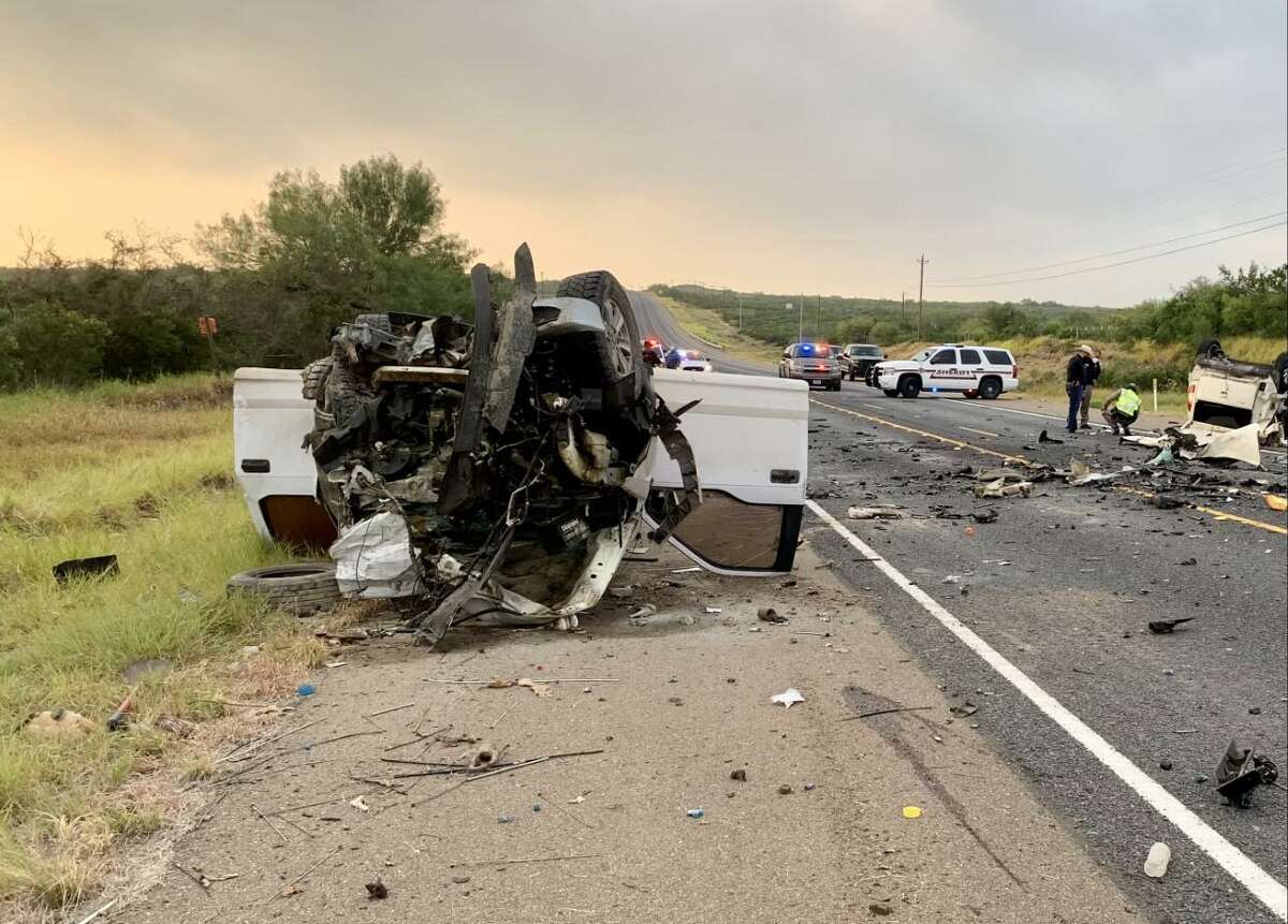 Authorities can be seen investigating a two-vehicle crash that claimed the life of a woman about 4 miles north of Zapata on Friday morning.