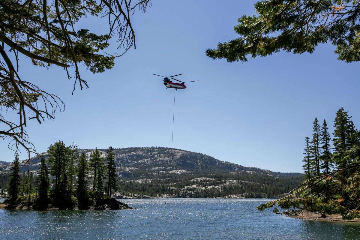 A heavy lift helicopter can be seen on a ridge near Kirkwood Mountain Resort on Wednesday, Sept. 1, 2021.
