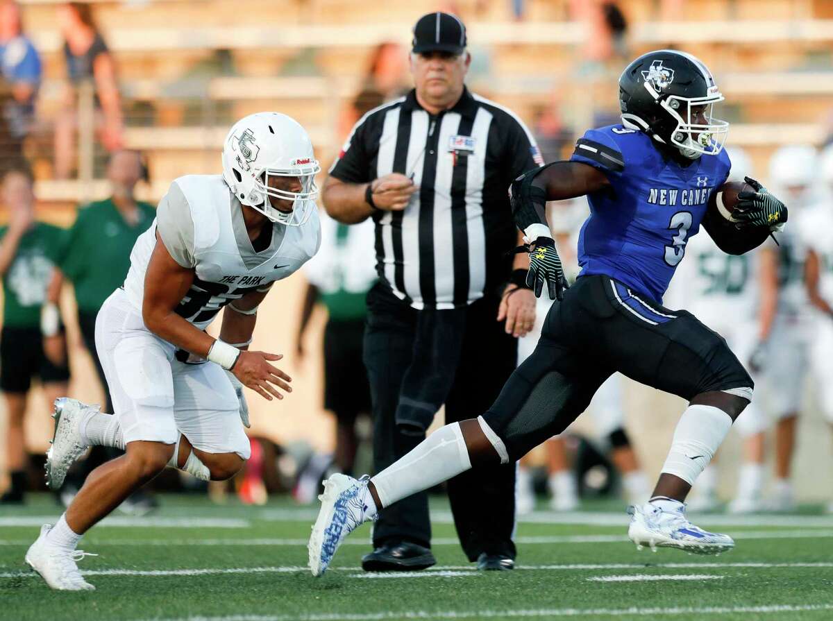 New Caney running back Kedrick Reescano (3) runs past Kingwood Park linebacker Joey Johnson (33) for a 31-yard gain during the first quarter of a high school football game at Randall Reed Stadium, Friday, Sept. 3, 2021, in New Caney.