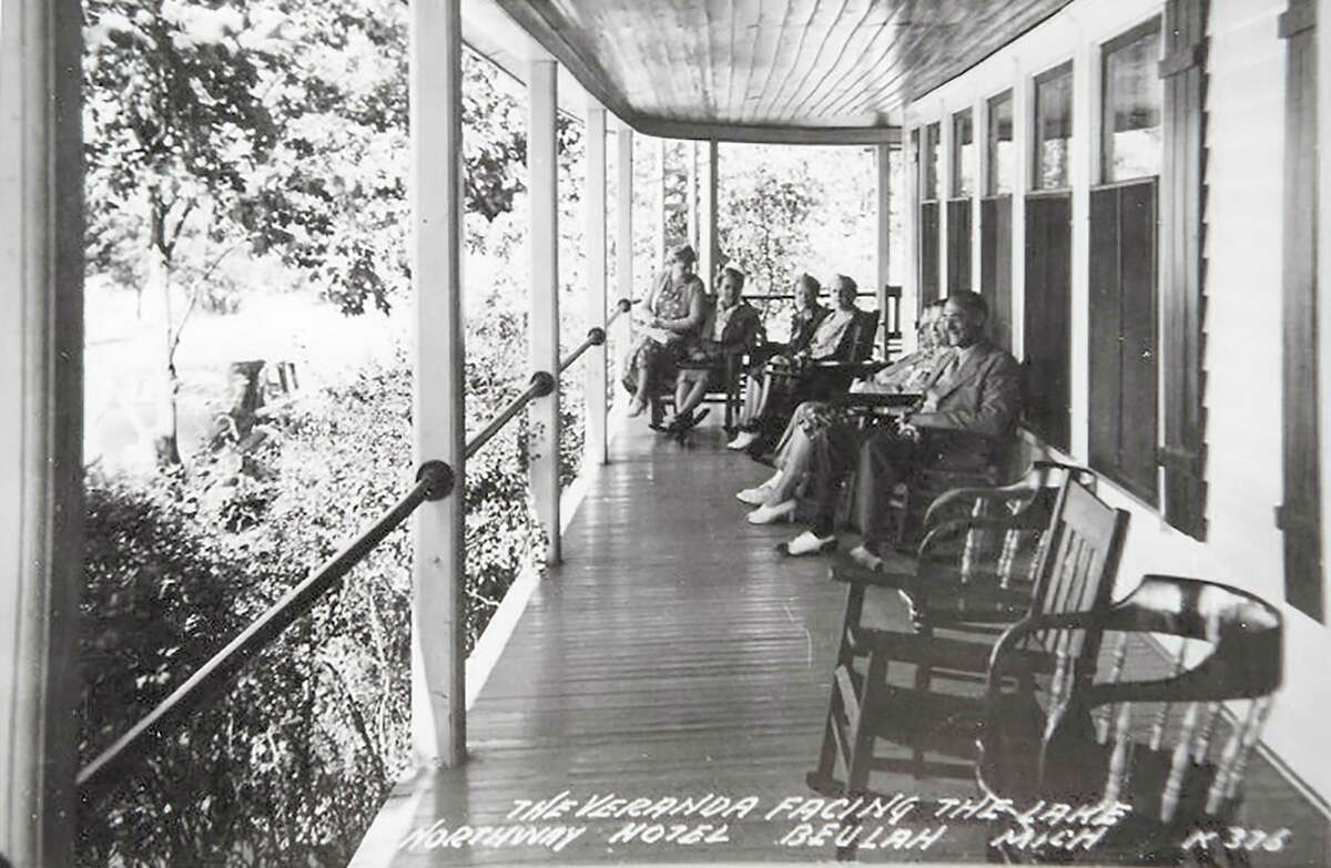Guests dressed up for dinner relax on the veranda overlooking Crystal Lake after dinner at the Northway Hotel, circa 1940. (Courtesy Photo)  