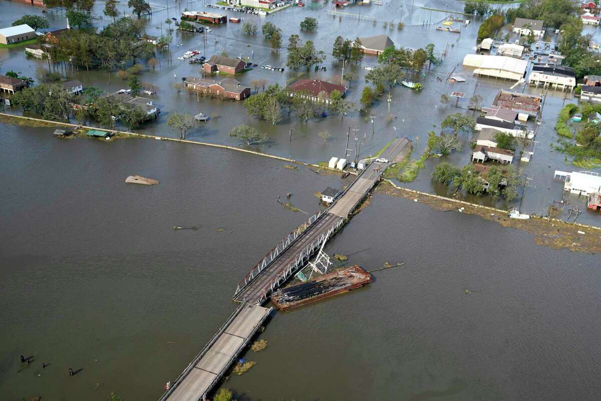 A barge settles on a bridge in the aftermath of Hurricane Ida, Monday, Aug. 30, 2021, in Lafitte, La.