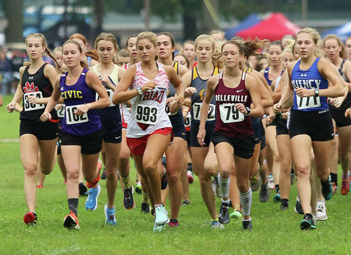 Runners vie for the early lead in the Granite City Invitational girls cross country race on Saturday morning at Wilson Park in Granite City. O’Fallon and Edwardsville tied for first, with O’Fallon winning the sixth-runner tiebreaker to claim the team championship.