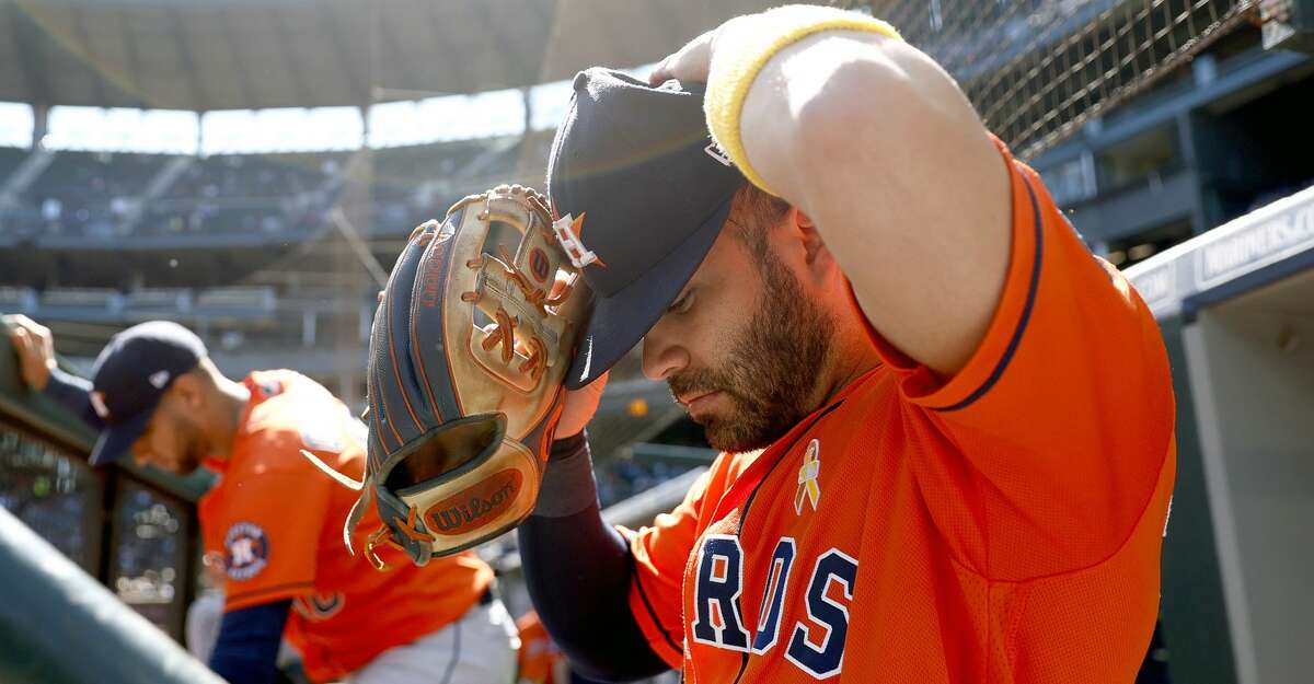 Jose Altuve #27 of the Houston Astros wears a gold arm band on "Childhood Cancer Awareness Day" during the game against the Seattle Mariners at T-Mobile Park on September 01, 2021 in Seattle, Washington. (Photo by Steph Chambers/Getty Images)