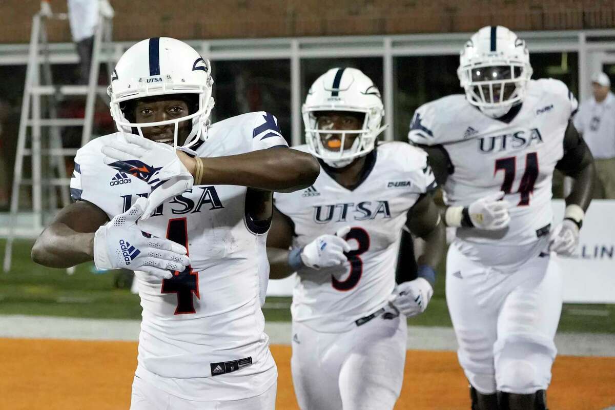 UTSA's Zakhari Franklin, left, celebrates his touchdown reception during the second half of an NCAA college football game against Illinois, Saturday, Sept. 4, 2021, in Champaign, Ill. (AP Photo/Charles Rex Arbogast)