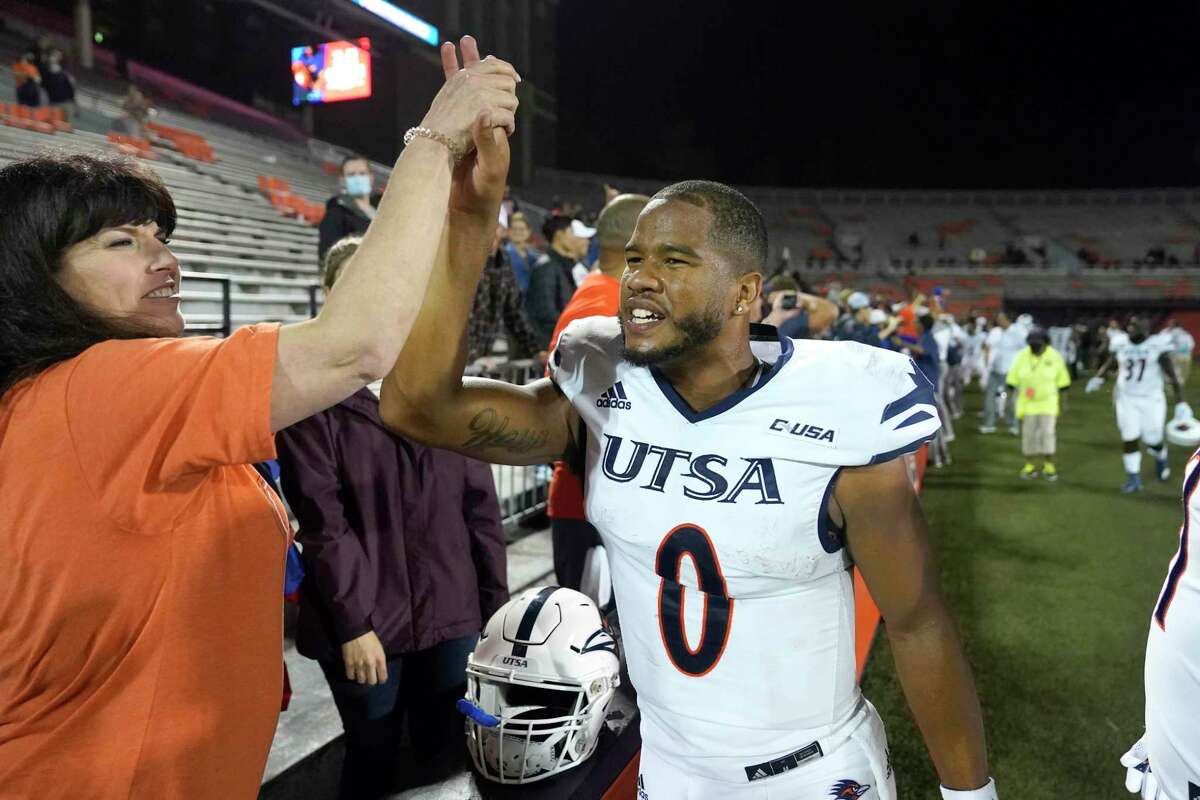 UTSA quarterback Frank Harris celebrates his team's win over Illinois in an NCAA college football game Saturday, Sept. 4, 2021, in Champaign, Ill. (AP Photo/Charles Rex Arbogast)