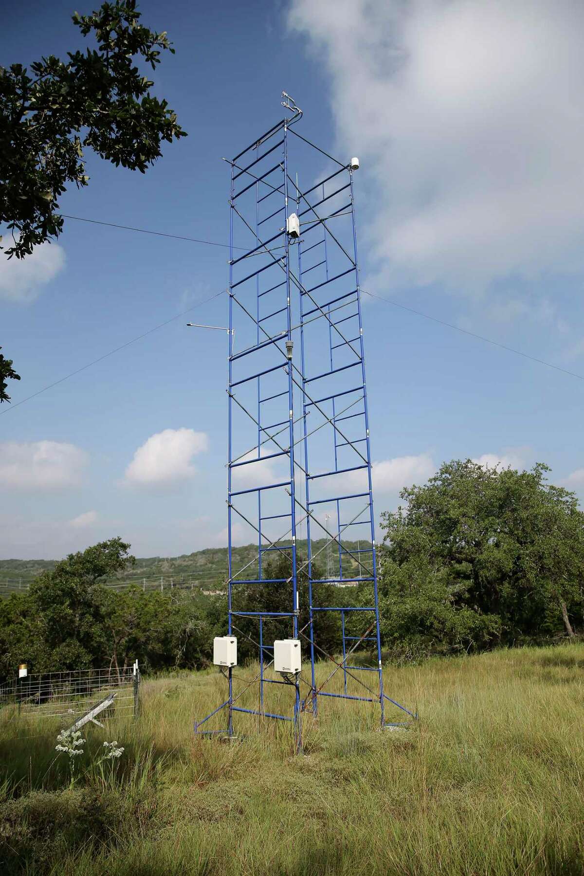 On top of a hill, a tower with instruments measures moister and carbon dioxide in the air at the Edwards Aquifer Conservancy Field Research Park on Wednesday, Sept. 1, 2021.