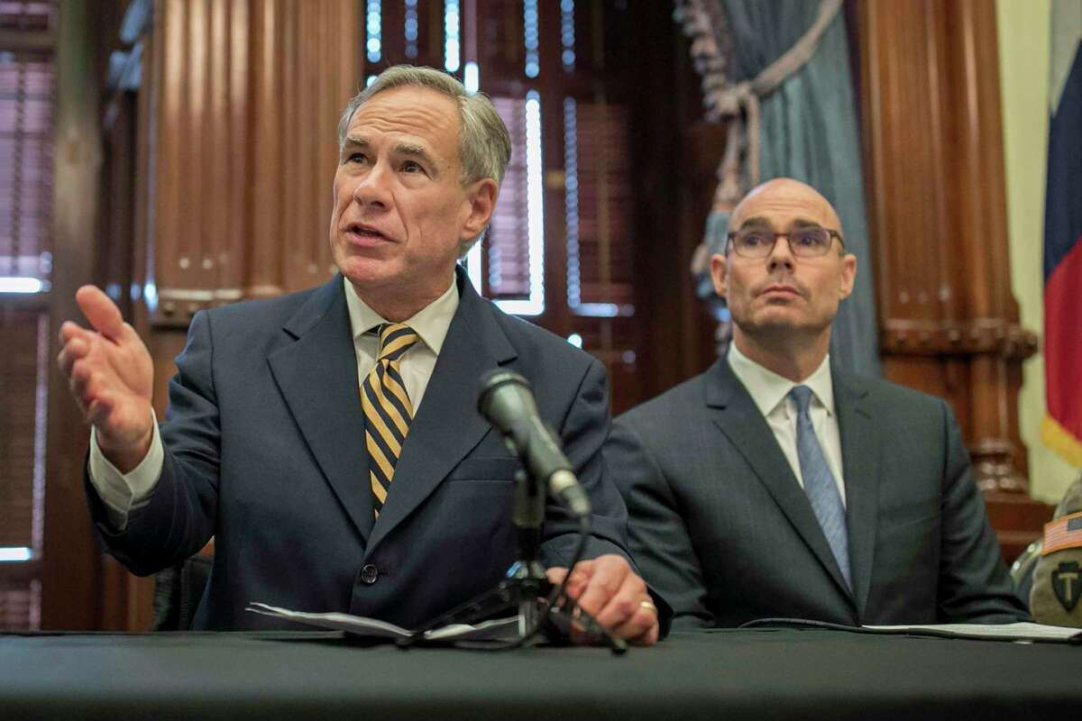 In this June 21, 2019 photo, Gov. Greg Abbott, left, speaks at a news conference at the Capitol, in Austin, Texas.