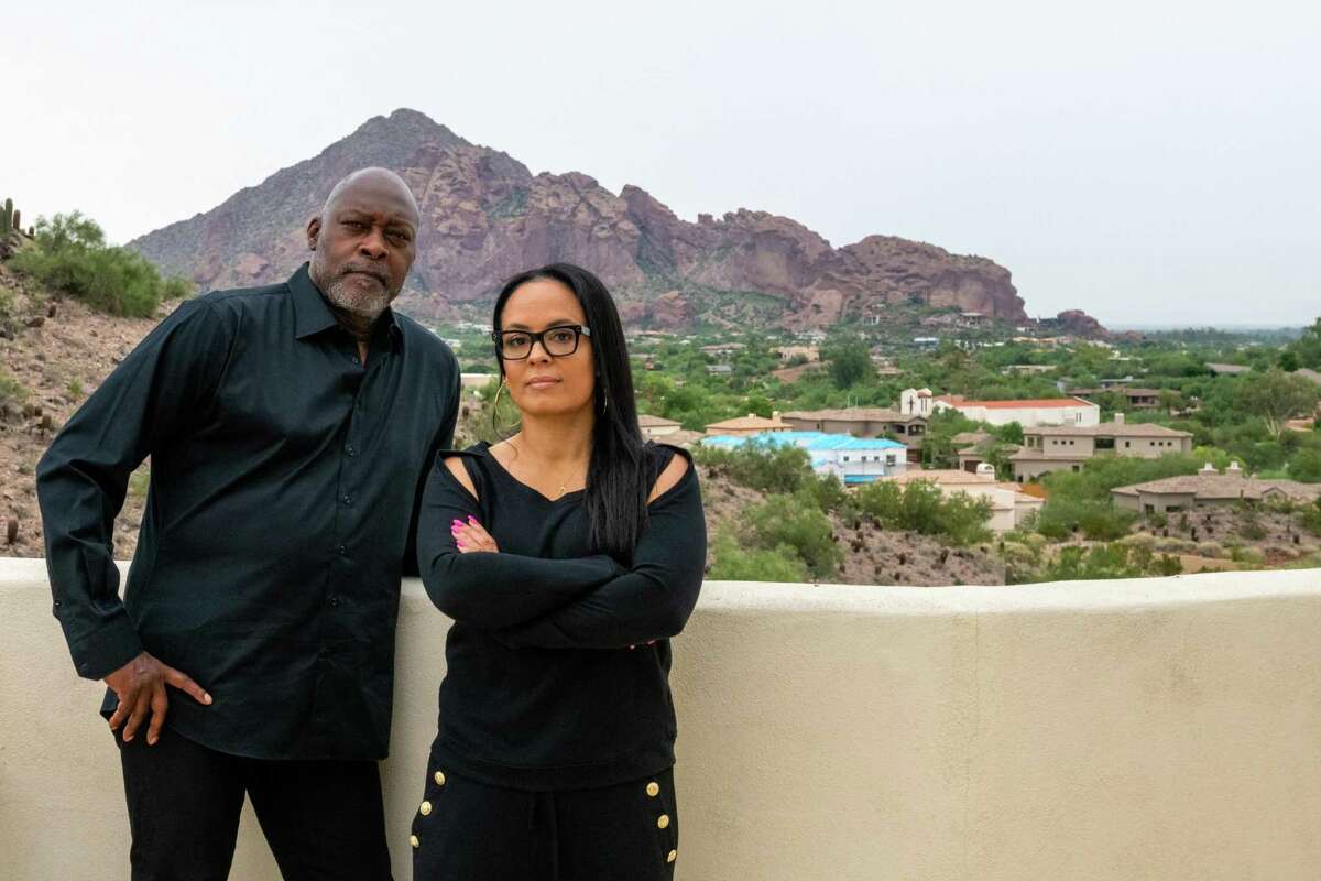 Dave Stewart and Lonnie Murray pose for a portrait at their home on Tuesday, Aug. 31, 2021, in Phoenix, Ariz. They were not chosen to enter negotiations with the city to develop the Coliseum site.