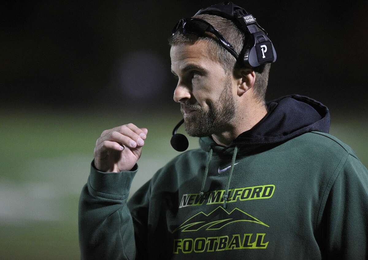 New Milford coach Sean Murray follows the action in the first half against Fairfield Warde during an alliance football game at Fairfield Warde High School in Fairfield, Conn. on Oct. 25, 2019. Warde defeated New Milford 34-21.