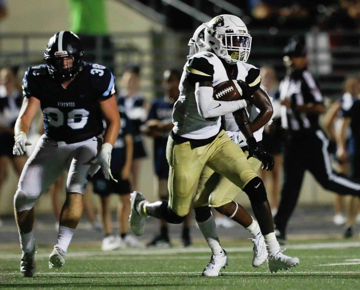 Conroe wide receiver Louis Williams III (3) runs for a 47-yard touchdown during the third quarter of a non-district high school football game at Turner Stadium, Thursday, Sept. 2, 2021, in Humble.