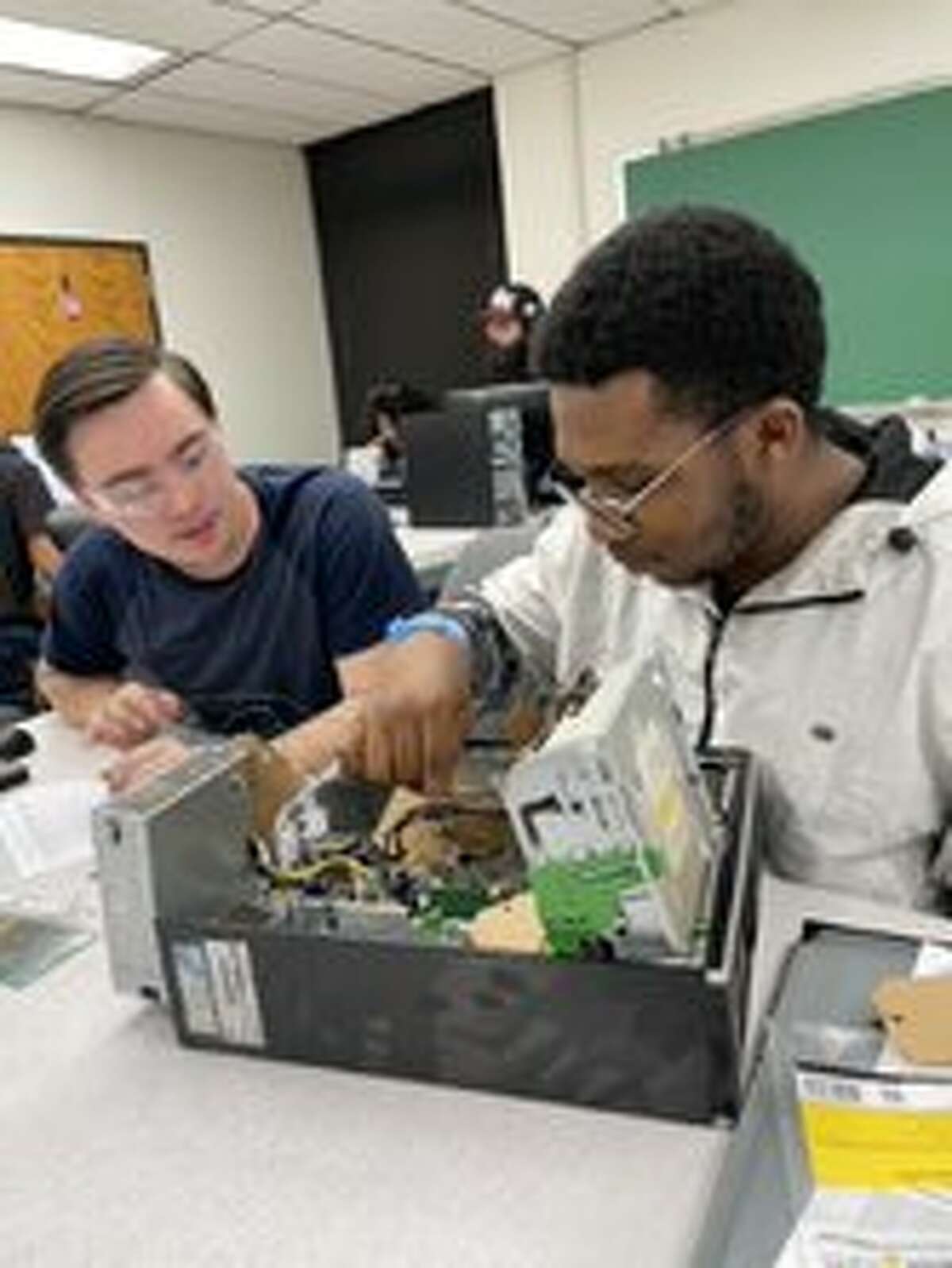 Dabrien Ramirez, left, and Cletus (Clay) Maduabuchuku were among the students in MC’s PC Hardware class that utilized a $10,000 donation of computers from Mark Knox Flowers.