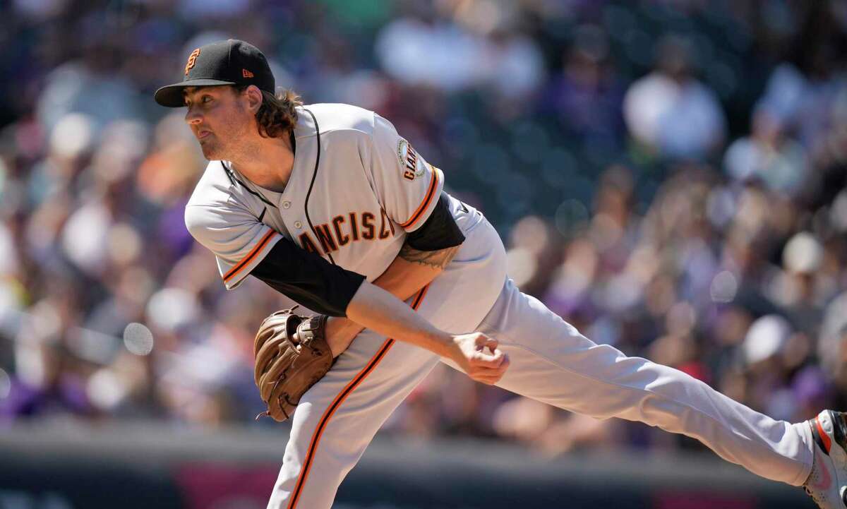 San Francisco Giants starting pitcher Kevin Gausman works against the Colorado Rockies in the first inning of a baseball game Monday, Sept. 6, 2021, in Denver. (AP Photo/David Zalubowski)