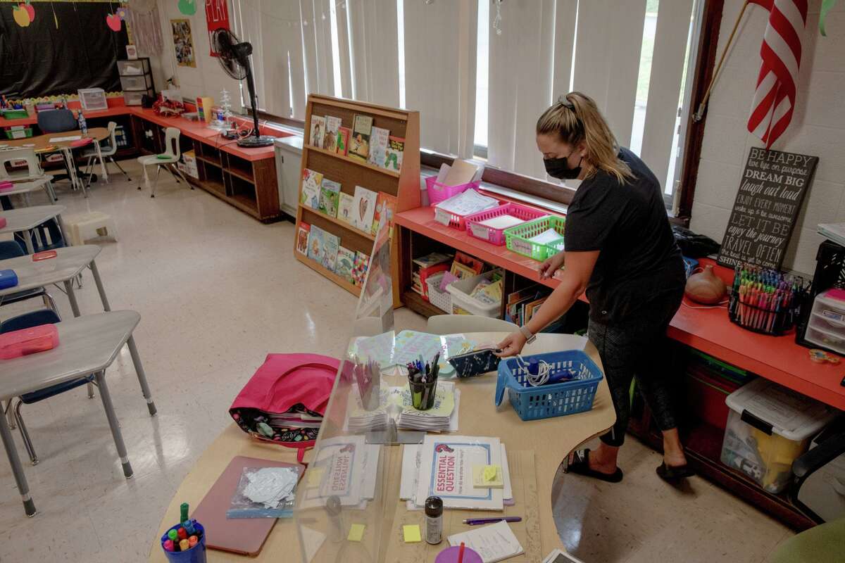 Teacher Courtney Haskell prepares for the upcoming school year. Different from last year, students in her class will be allowed to share books in the bookshelf in the classroom.