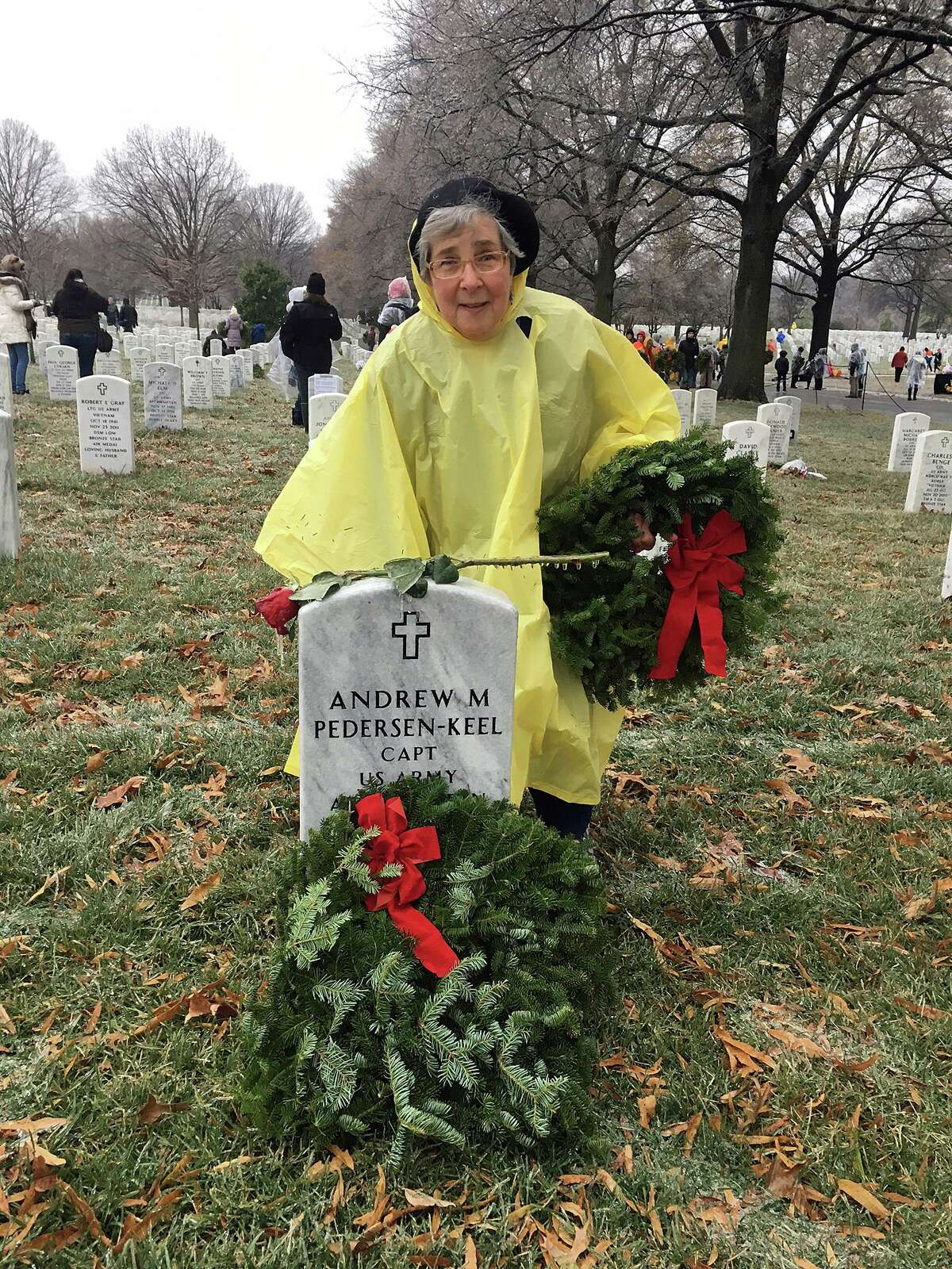 Barbara “Bobbi” Racette laying wreaths at Arlington National Cemetery as part of the Wreaths Across America movement