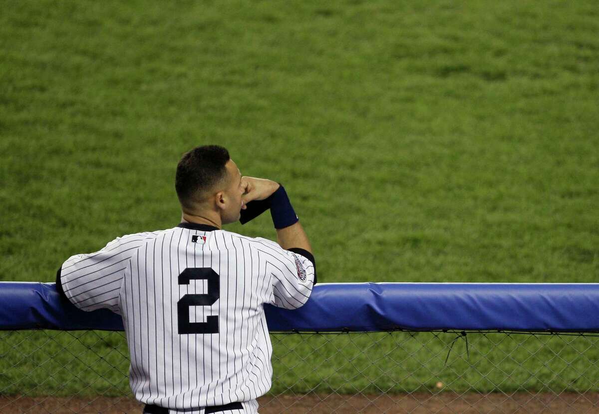 New York Yankees' Derek Jeter watches from the dugout during the ninth inning against the Boston Red Sox in a baseball game Thursday, April 17, 2008, at Yankee Stadium in New York. The Red Sox won 7-5. (AP Photo/Julie Jacobson)