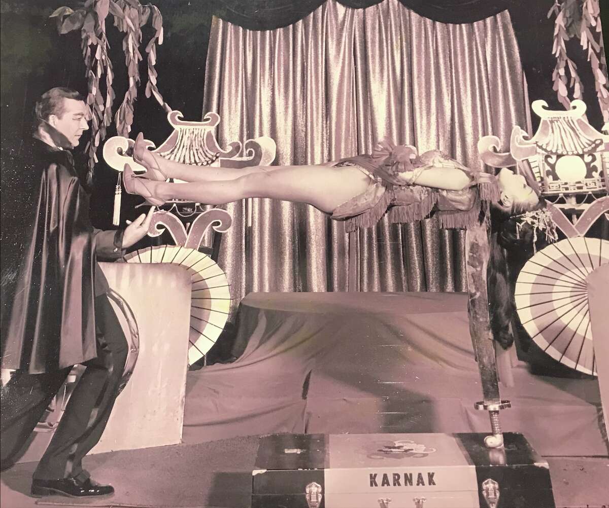 Coby Yee performs in a magic act at the Forbidden City on Sept. 24, 1966.