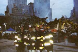 Greenwich volunteer firefighters Sandy Kornberg, Anthony Medico, Andrew "Duke" Maloney and Frank Napolitano at Ground Zero on Sept. 27, 2001.