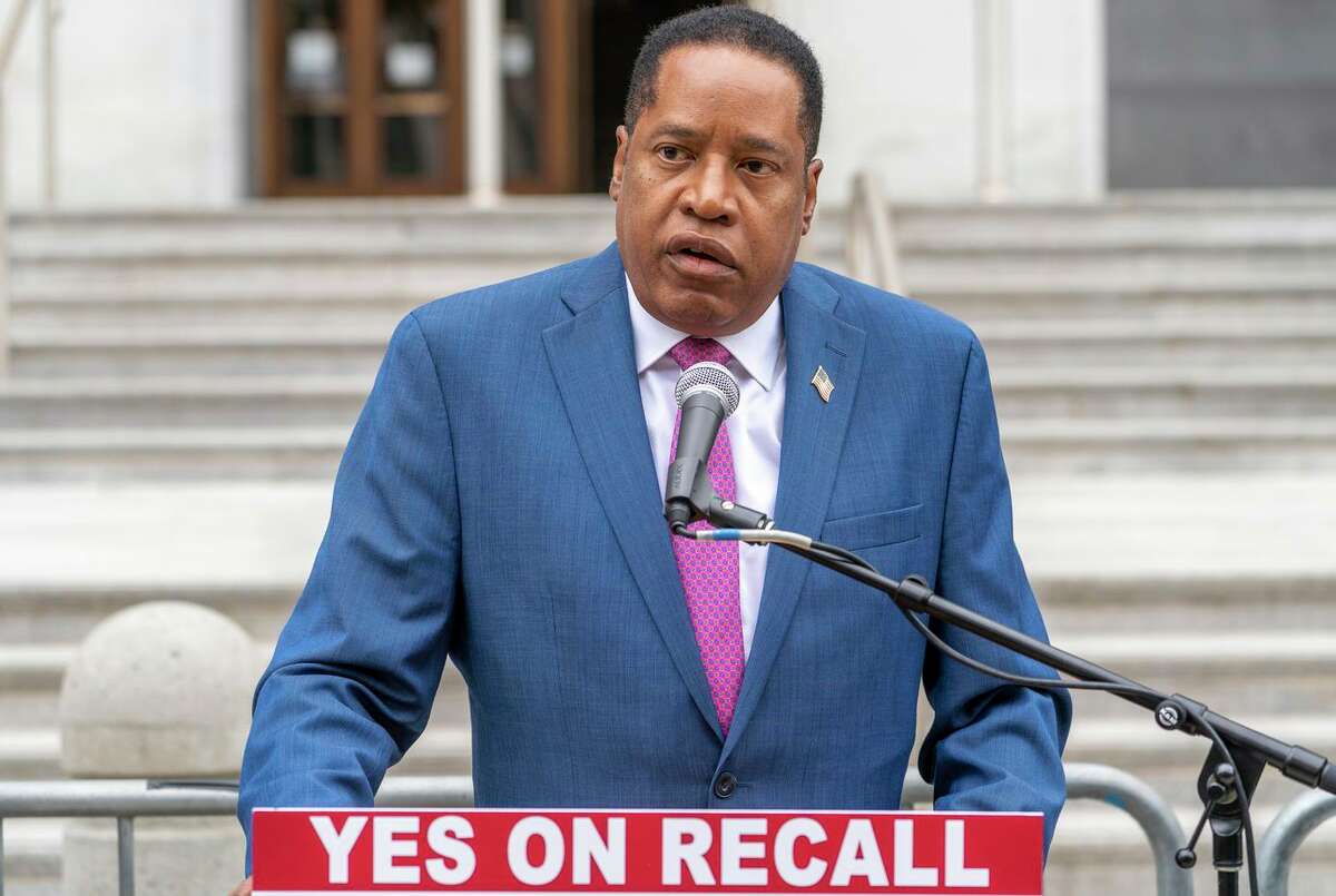 Conservative radio talk show host Larry Elder speaks to supporters during a campaign stop outside the Hall of Justice downtown in Los Angeles on Thursday, Sept. 2, 2021.