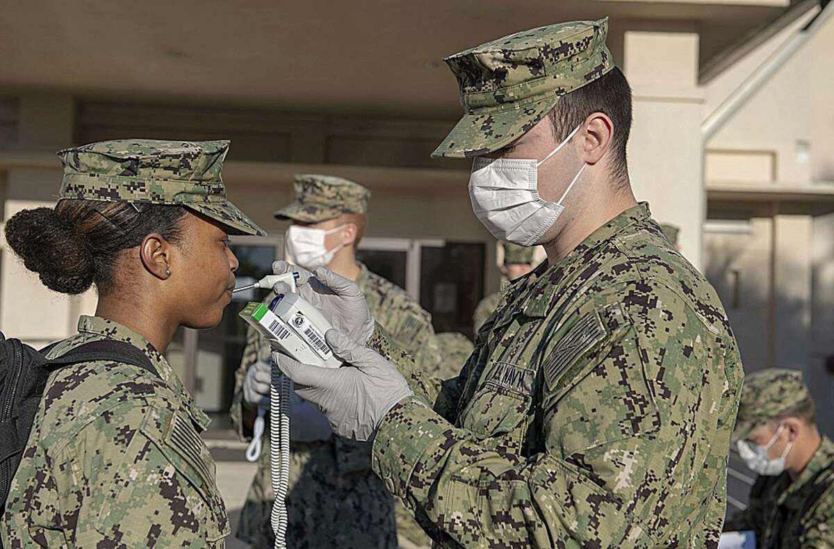 Hospitalman Hadlie Hinojosa, assigned to the U.S. Navy's Expeditionary Medical Facility, prepares to deploy from Naval Air Station Jacksonville, Fla. to New Orleans in April, 2020. This year, medical teams sent by U.S. Army North to support civilian hospitals overwhelmed by COVID patients have started up again after a pause during the summer.