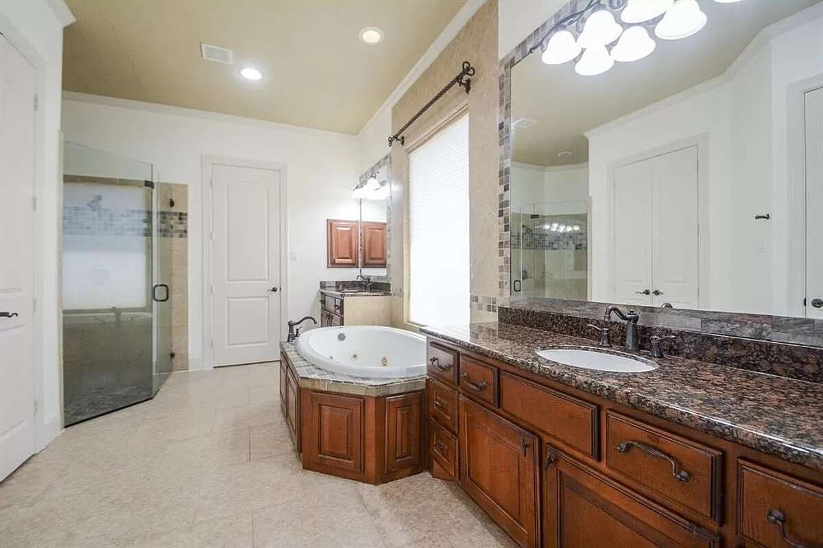 The primary bathroom has a Jacuzzi tub and a shower.