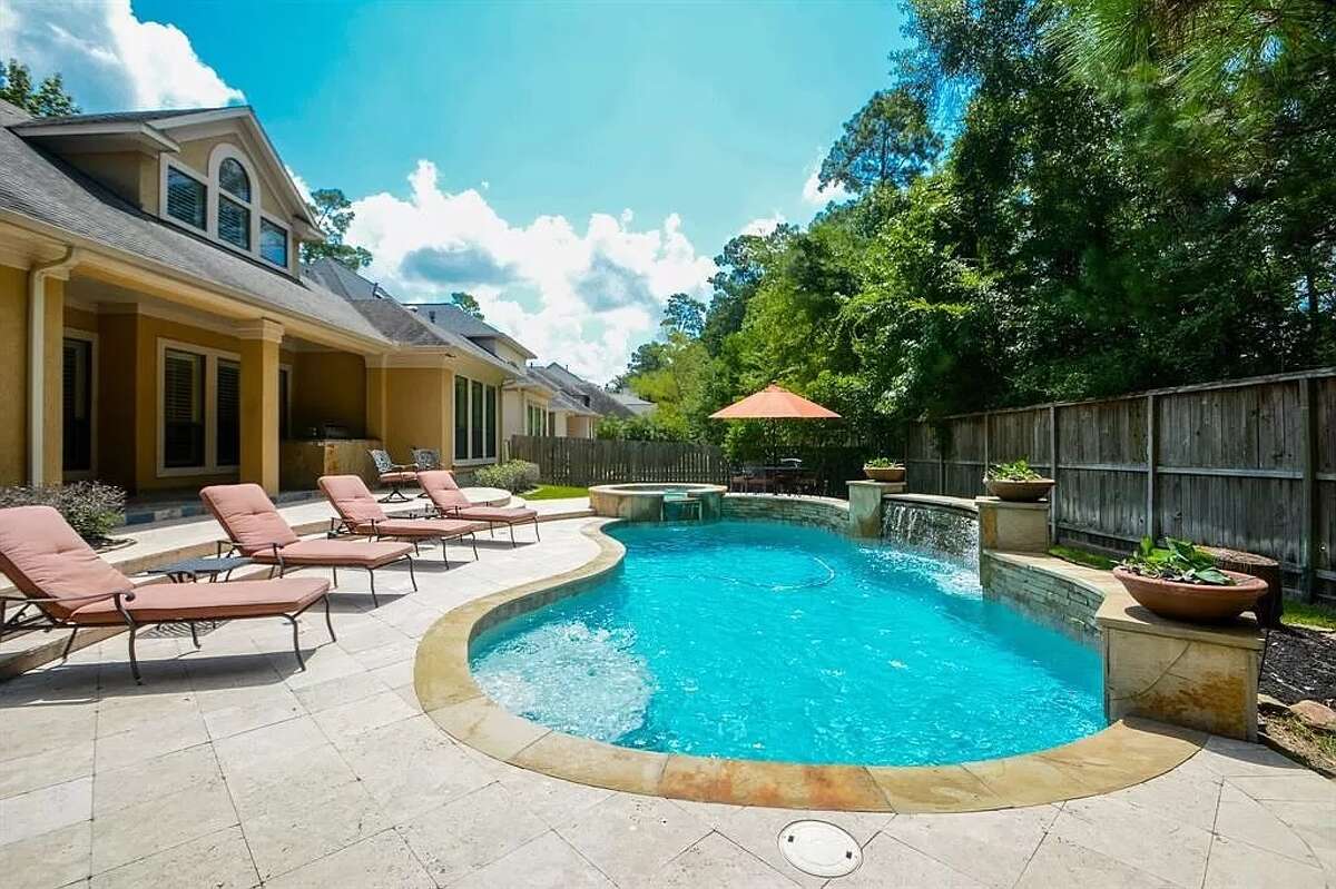A sizable pool can be found in the backyard.