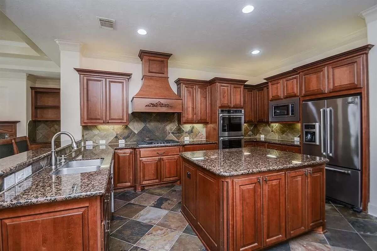 The kitchen has a gas range and two ovens.