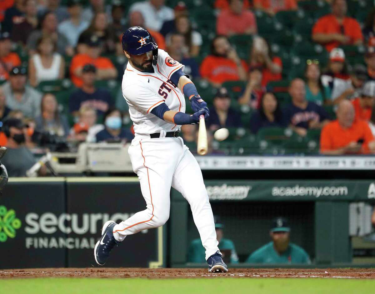 Seattle Mariners' Luis Torrens reacts after he slid safely home to score on  a RBI single hit by Ty France during the sixth inning of a baseball game  against the Houston Astros