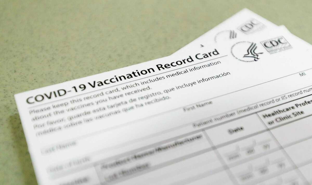 A COVID-19 vaccination record cards are seen at one of Montgomery County's COVID-19 vaccination sites. Montgomery County hospitalizations related to COVID-19 have passed 400 patients as active cases continue to soar.
