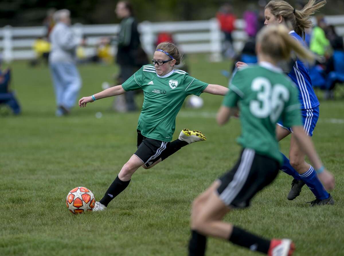 Midland Fusion's Ellie Senkowski prepares to clear the ball during the Midland Invitational soccer tournament on May 11, 2019.