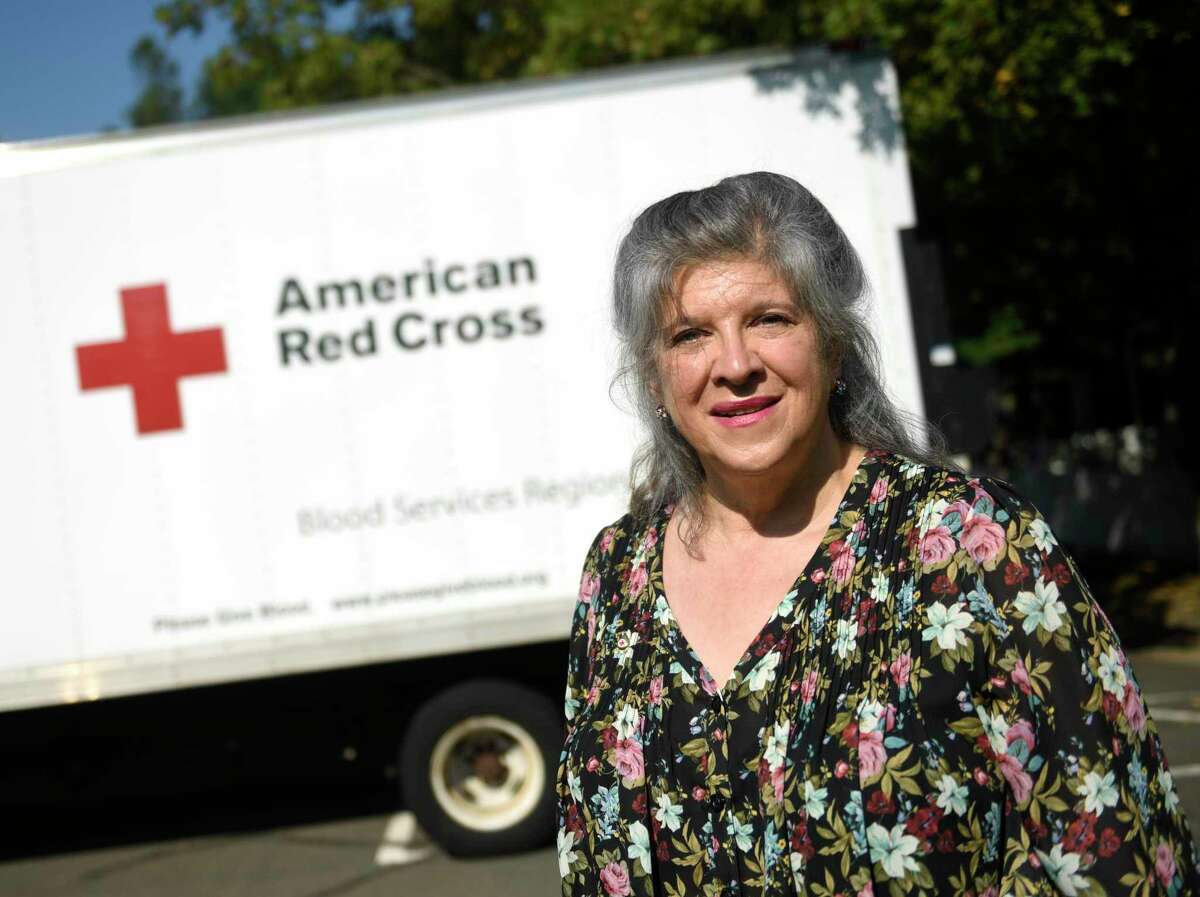 Stamford resident Betsy Henry, 68, poses after donating her 224th pint of blood at Stamford Church of Christ in Stamford, Conn. Wednesday, Sept. 8, 2021. Henry is applying to become the Guinness World Record holder for most blood donated by a woman.