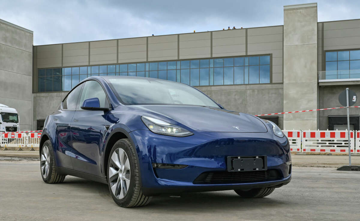 A Tesla Model Y electric vehicle stands at the construction site of the Tesla Gigafactory Berlin-Brandenburg.