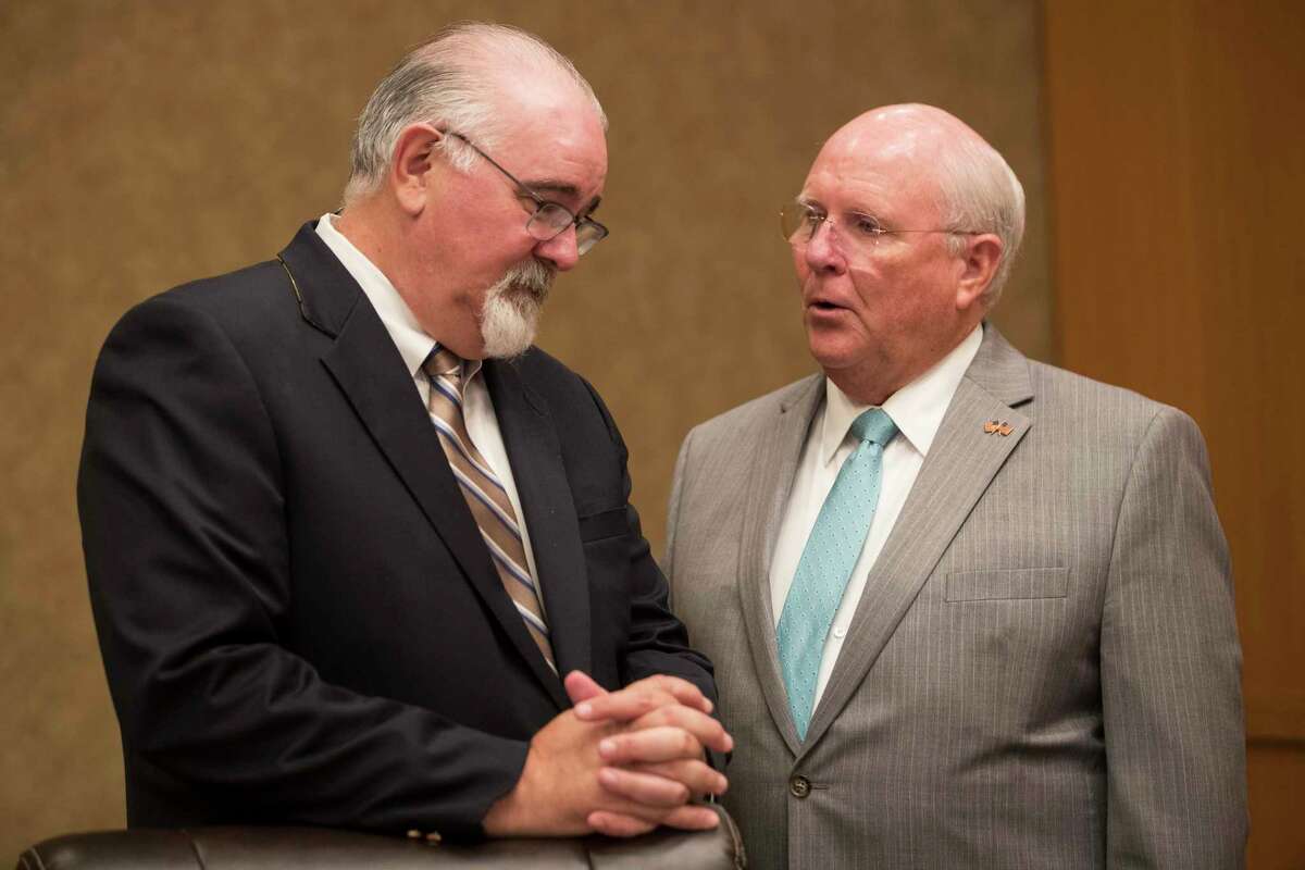 County Commissioners Jack Cagle, left and Tom Ramsey, shown here in July, have sued County Judge Lina Hidalgo and Harris County over the redistricting plan approved last month.