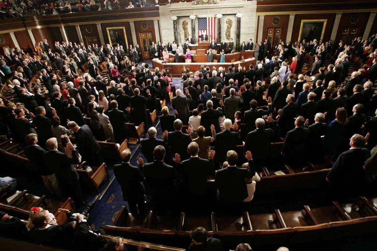 House members of the 109th Congress take their oath from House Speaker Dennis Hastert of Ill., on the floor of the House, Tuesday, Jan. 4, 2005 on Capitol Hill.