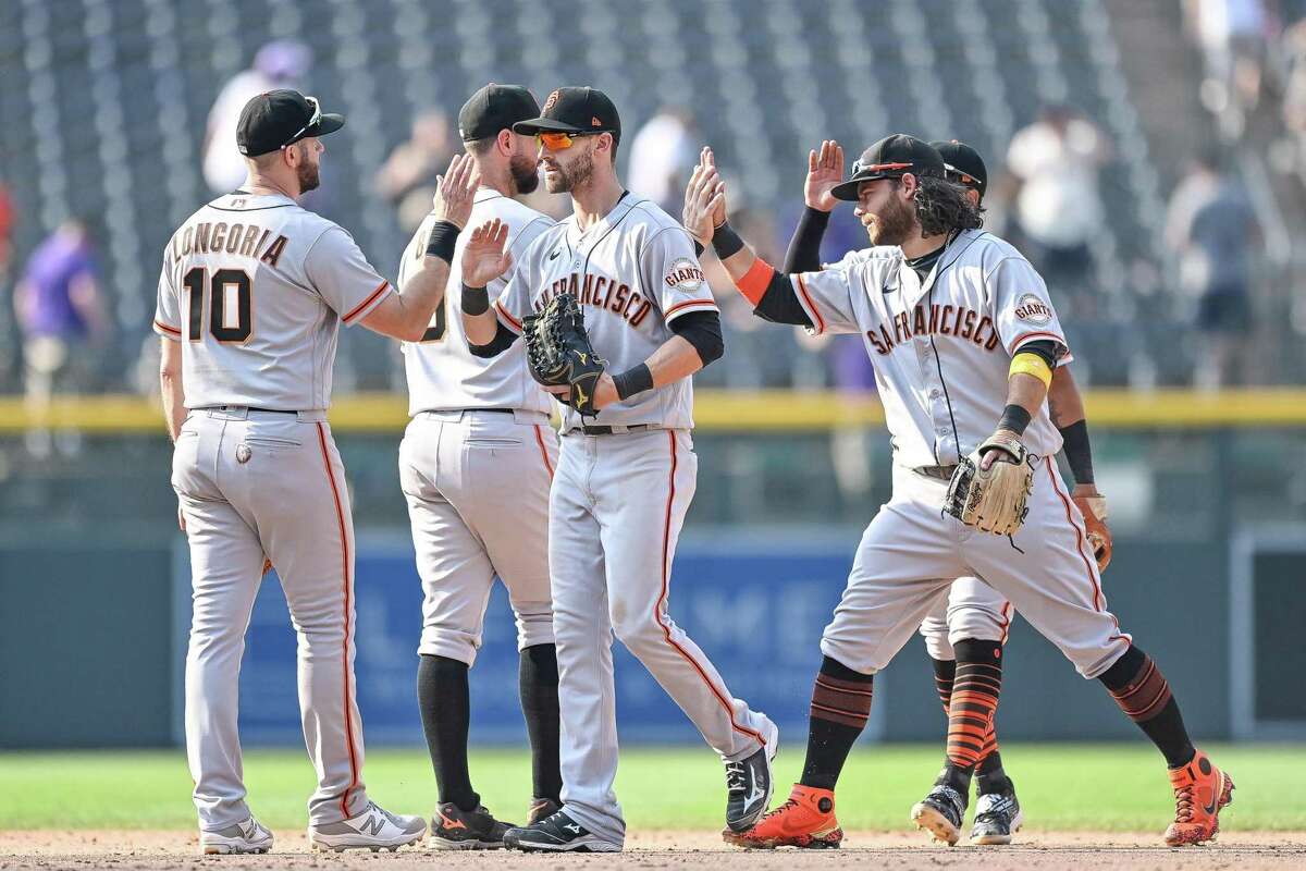 LaMonte Wade Jr. #31 of the San Francisco Giants is congratulated