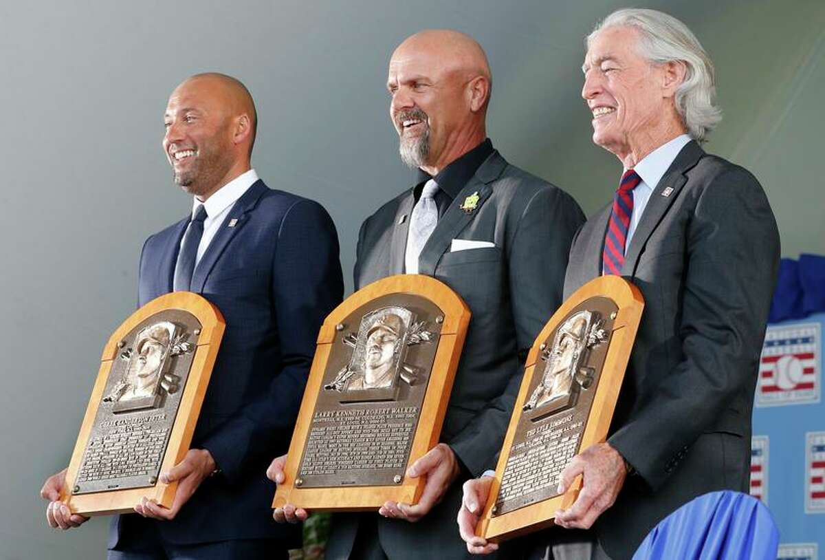 Derek Jeter, Larry Walker and Ted Simmons pose with their plaques during their Hall of Fame induction.