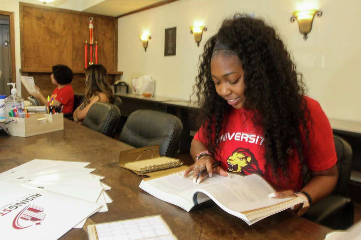 Tirranye Jones, a student at the University of St. Thomas, study in the Rising Stars lounge at The Black Lab. The Black Labrador, a Montrose mainstay for 33 years, has been converted to a space for current and past University of St. Thomas students and staff, who still call it the Black Lab.