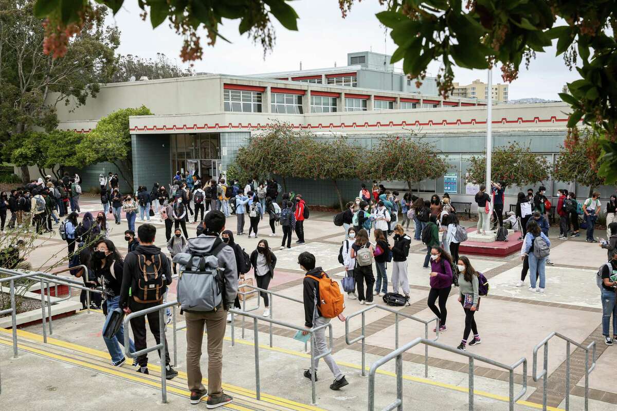 Students gather in the courtyard of Lowell High School in late August as classes let out for the day. Few San Francisco children have been hospitalized for COVID-19 during the course of the pandemic.