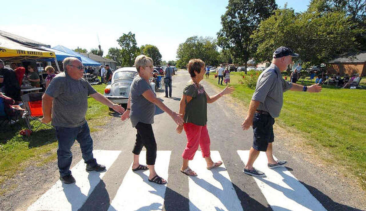 Guests walk a mock Abbey Road during the 2019 “When I’m 64 Beatles Festival.” The event was virtual last year, but is making a return from noon to 8:30 p.m. Saturday, Sept. 11, in Prairietown.