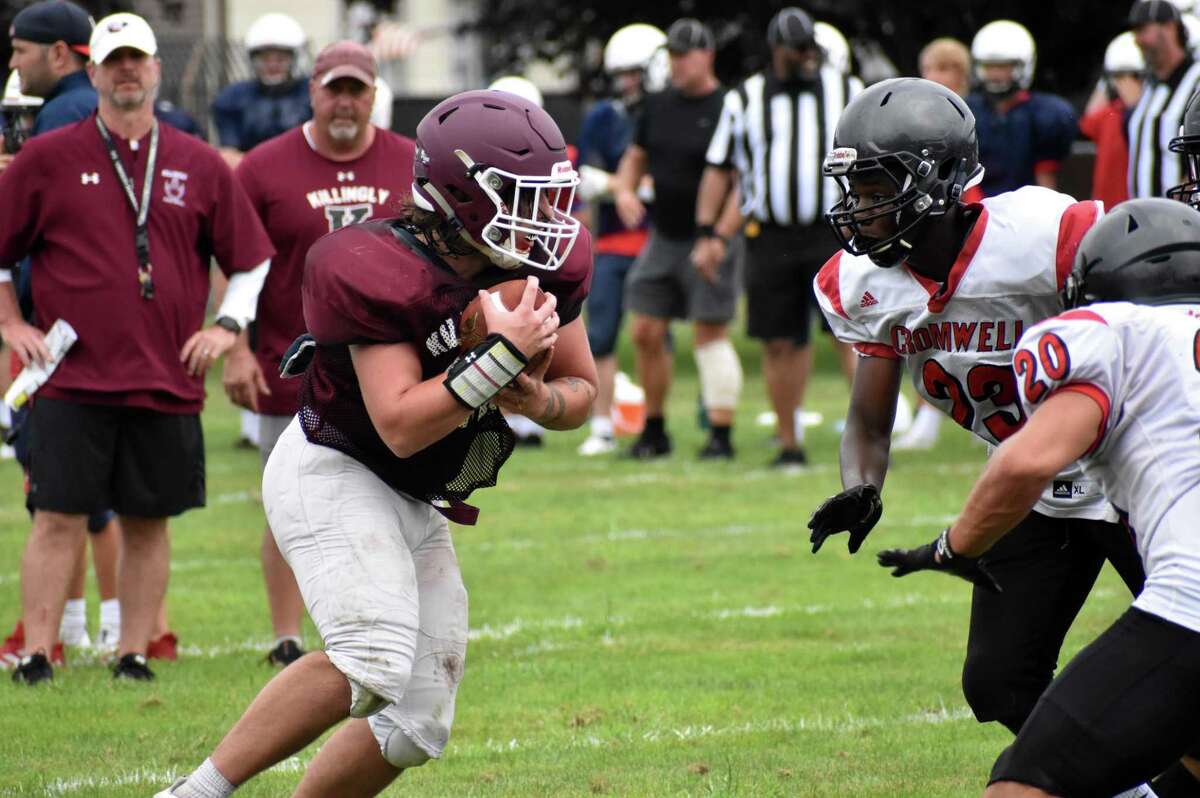 Killingly's Jack Sharpe runs the ball during a quad football scrimmage at Pierson Park, Cromwell on Saturday, Aug. 28, 2021.