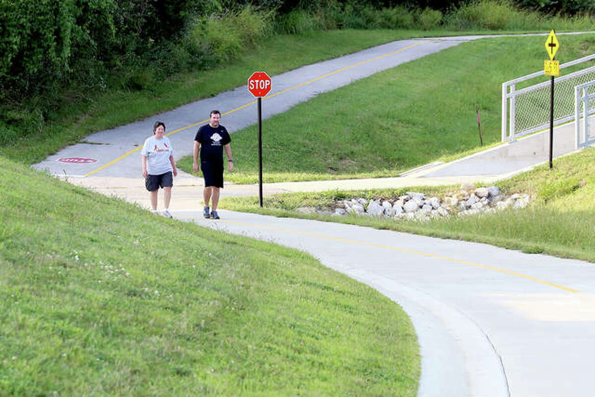 Nida and Steven Graham enjoy a 990-foot stretch of trail between Center Grove and Madison County Transit’s Nature Trail on the west side of Route 157 last year. 