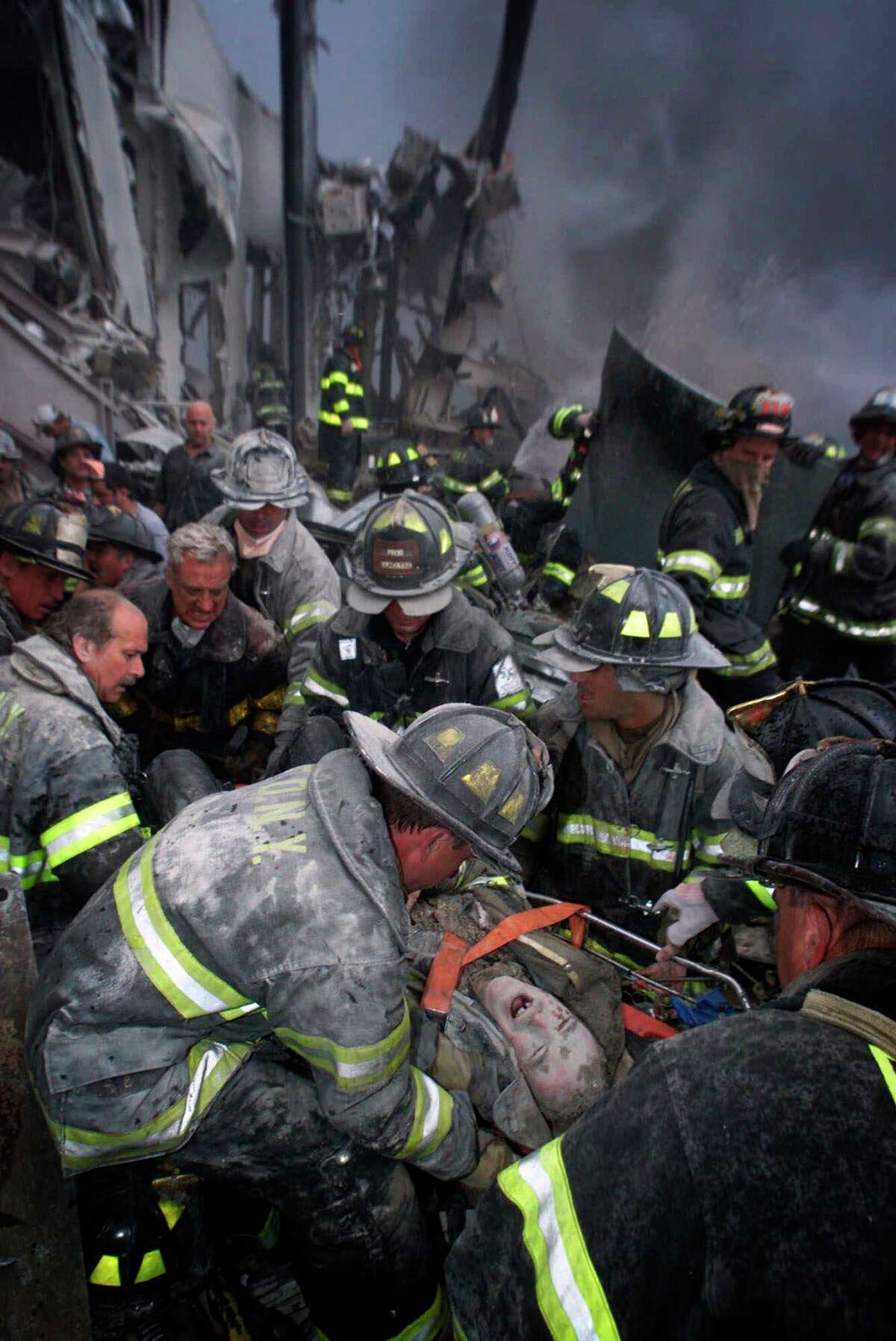 A fireman screams in pain as he is rescued shortly after both towers of New York's World Trade Center collapsed.