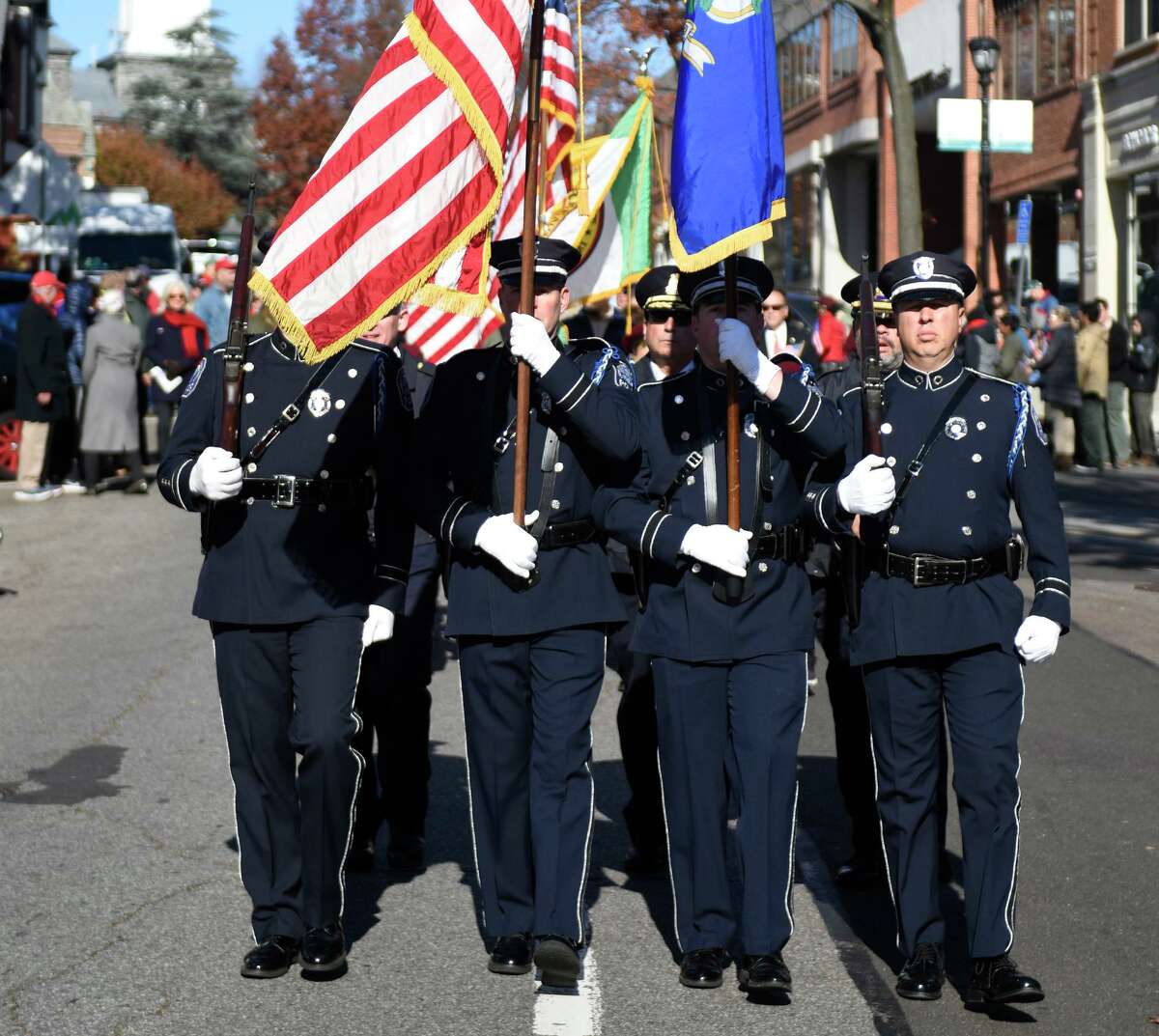 Greenwich Police march in the annual Veterans Day Patriotic Walk down Greenwich Avenue in Greenwich, Conn. Sunday, Nov. 11, 2018.