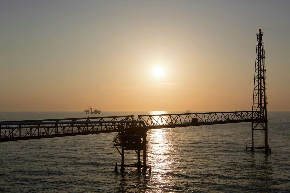 In this file photo, the sun sets over a connecting bridge at the Petroleos Mexicanos (Pemex) Pol-A Platform complex, located on the continental shelf in the Gulf of Mexico, 70 kilometers offshore from Ciudad del Carmen, Mexico. Pemex was awarded the majority ownership of a reservoir discovered in the Gulf of Mexico by the Houston company Talos. ,