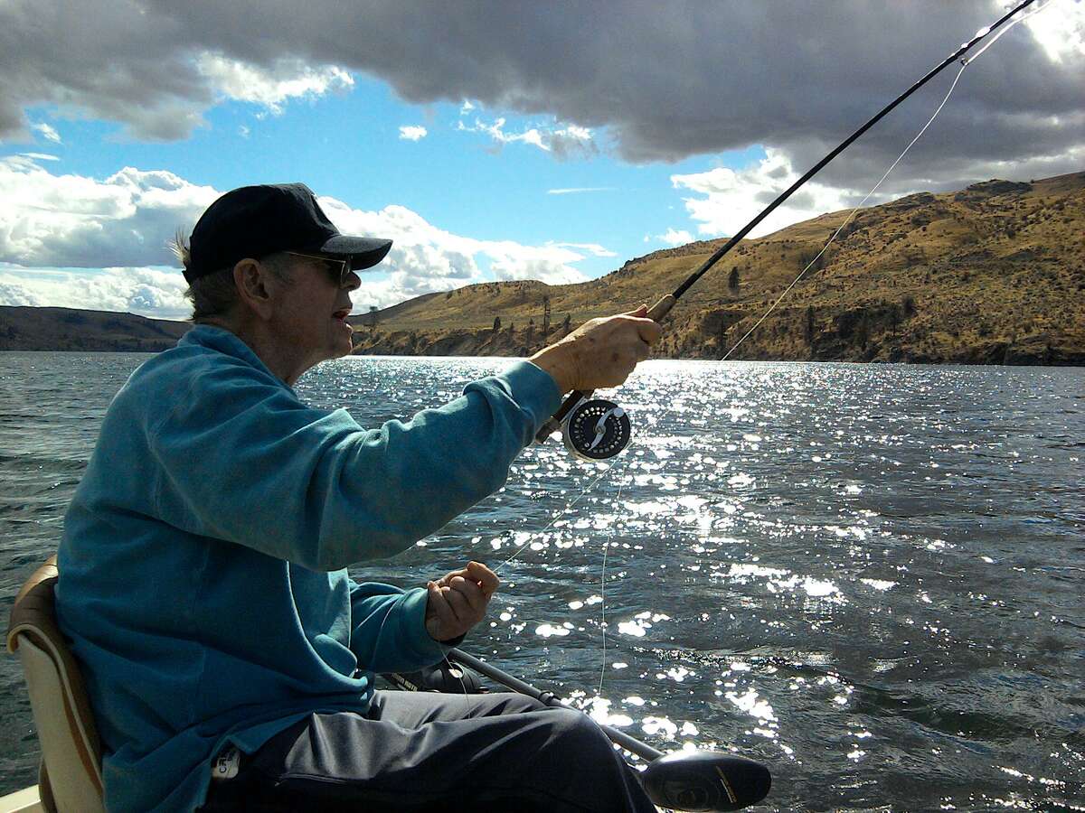Legendary flyfisher Ed Rice, nearly blind, casts on his last trip to Rufus Woods Lake for large rainbow trout.