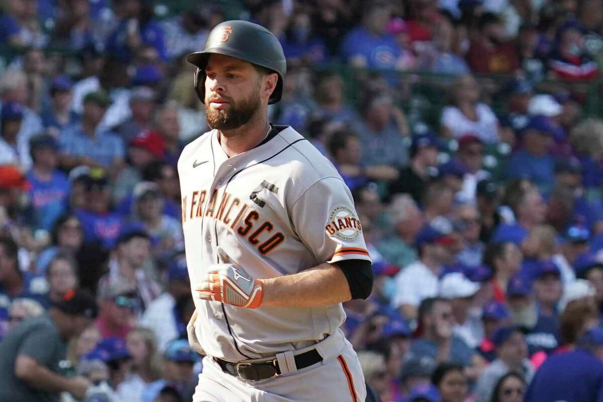 Brandon Belt played wearing a 'C' formed from electrical tape on