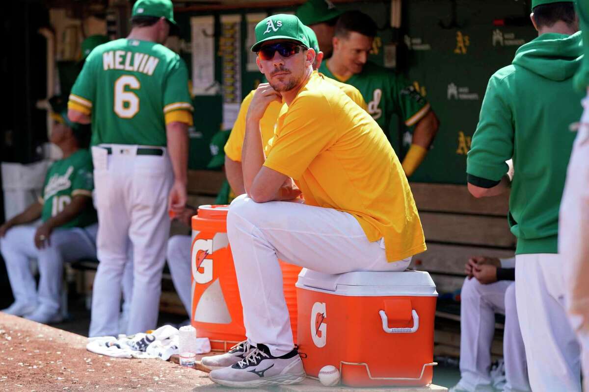 Injured Oakland Athletics' Chris Bassitt watches during a baseball game against the Chicago White Sox in Oakland, Calif., Thursday, Sept. 9, 2021. (AP Photo/Jeff Chiu)